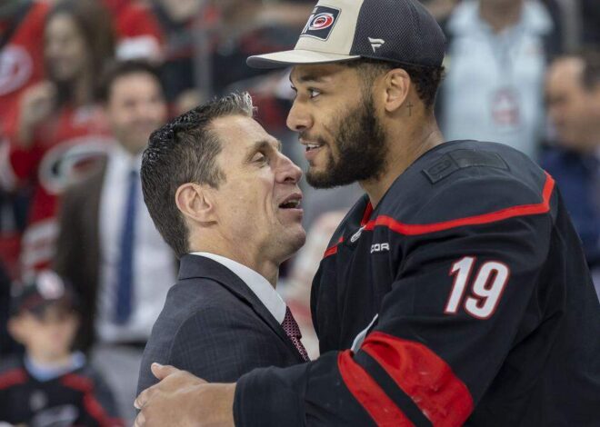Carolina Hurricanes win leads to special moment for K’Andre Miller and baby son