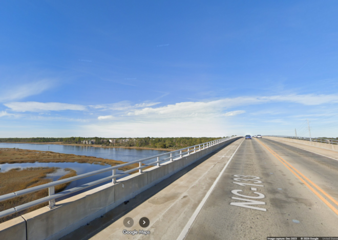 SUV knocks officer over the hood of his squad car on coastal bridge, NC police say