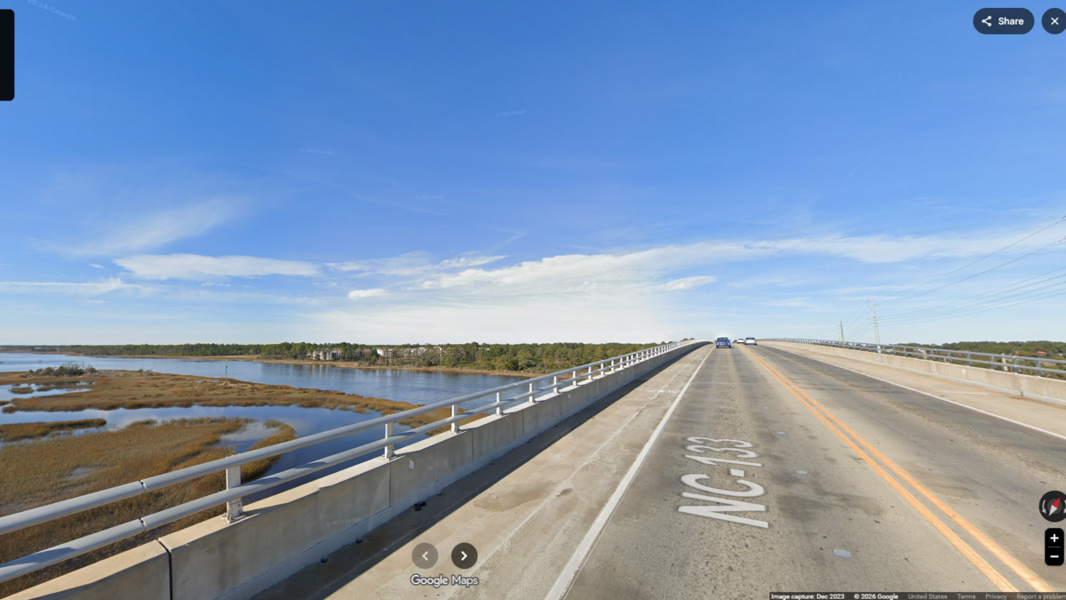 SUV knocks officer over the hood of his squad car on coastal bridge, NC police say