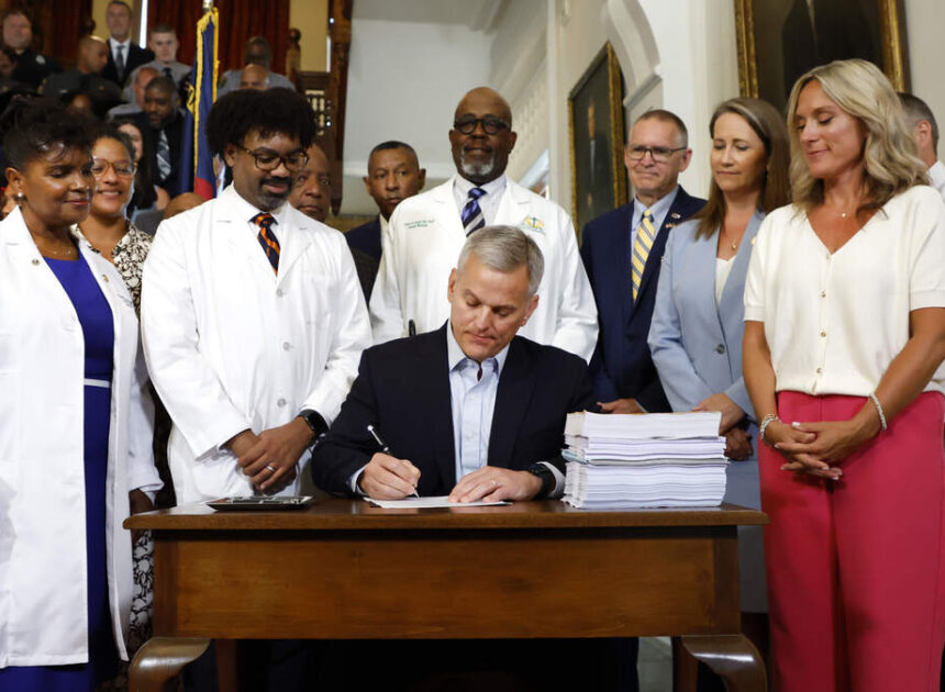 NC budget with year-delayed raises is now law. Gov. Stein signs spending plan