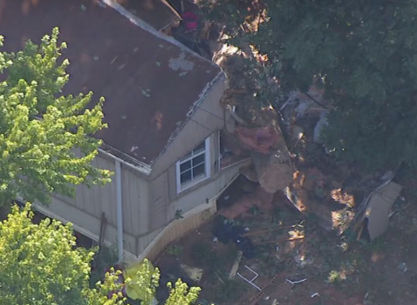 Tree crashes into Huntersville home, traps someone underneath, rescuers say