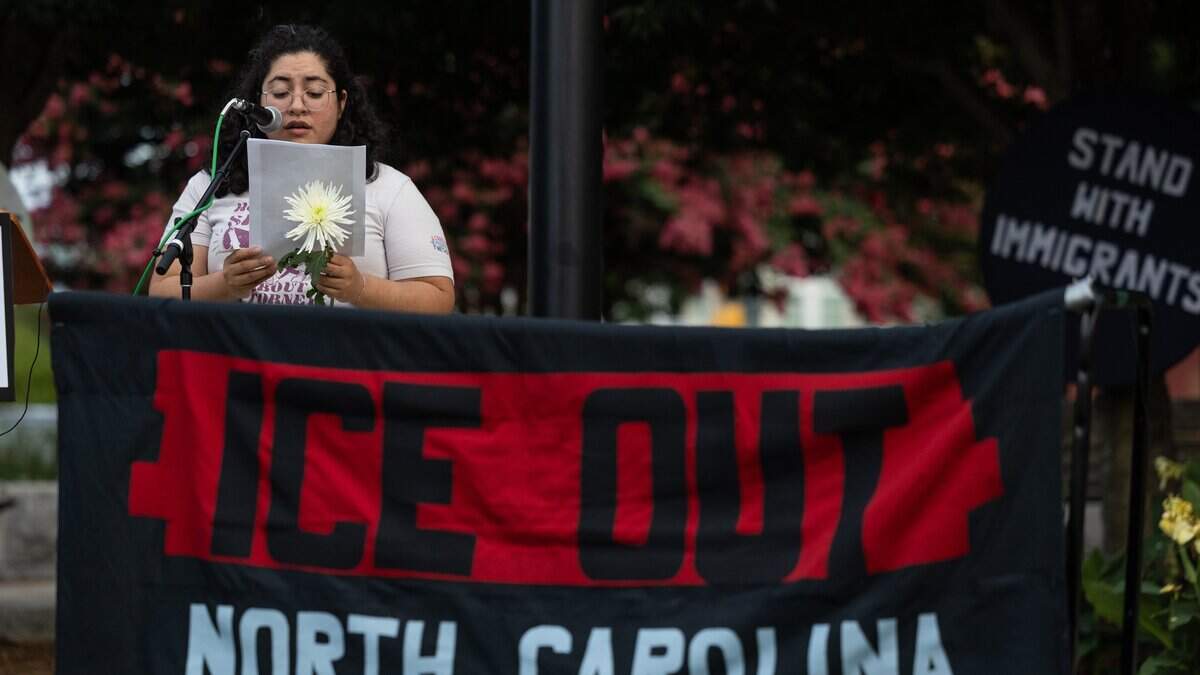 At uptown vigil, protesters condemn ICE killings, planned NC detention facility