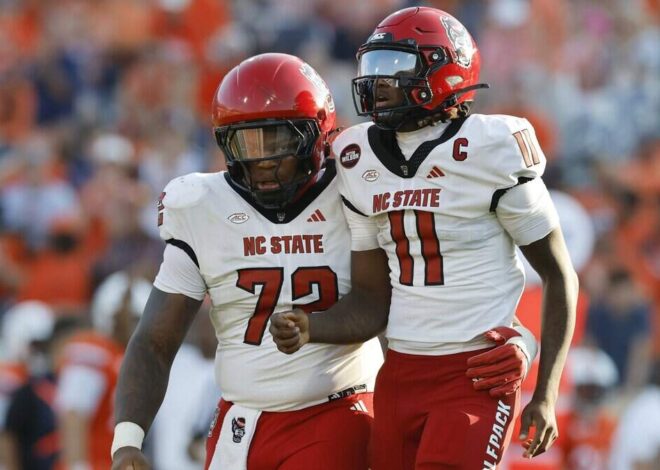 NC State football opens the season with big loss at Virginia. See photos from Week 0 game